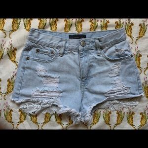 Ripped denim shorts with lace